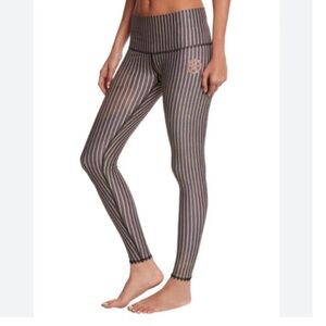 Teeki Dust in Gold striped leggings